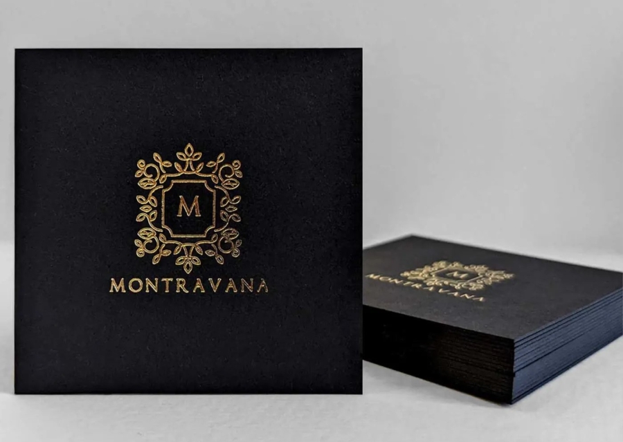 How can minimal business card designs balance the need to include basic contact information?